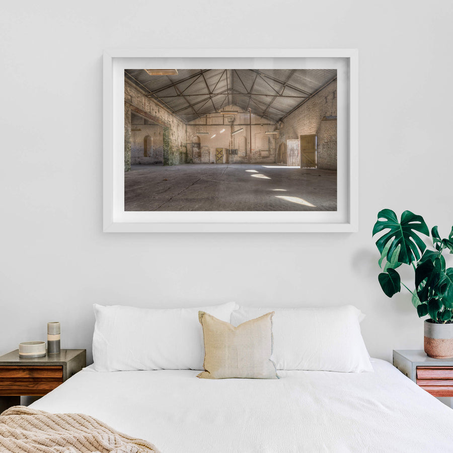 Electrical Workshop at Portland Cement Works, steel roof trusses span the full width of the workshop, supported by thick.