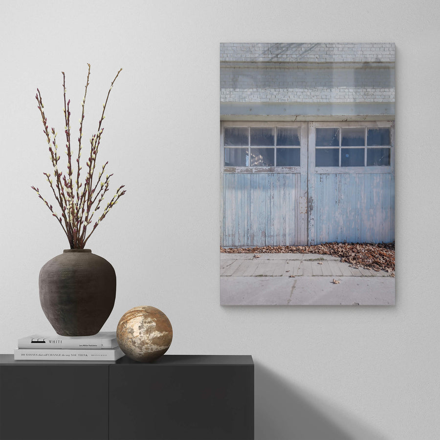 Machine Shop Door at Portland Cement Works, a pair of timber doors sit flush against a pale brick facade.