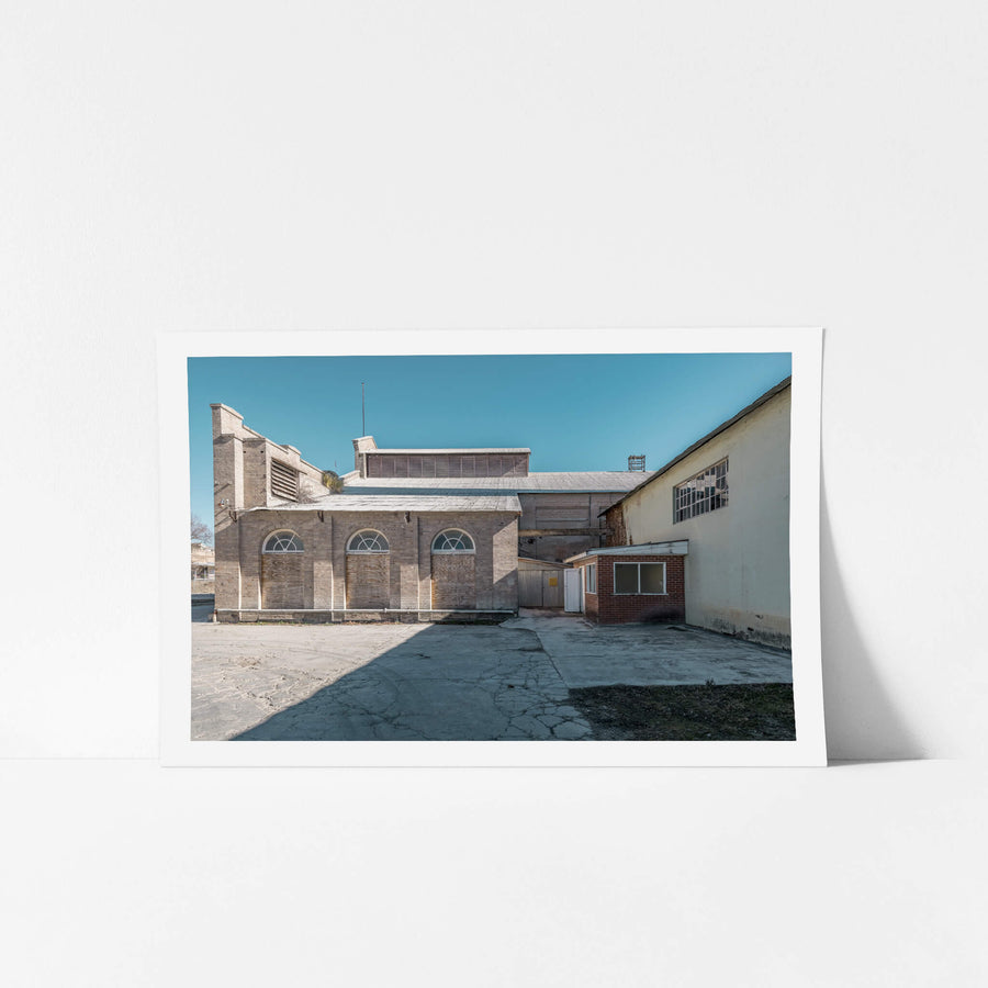 Power House Platform Side Exterior at Portland Cement Works, cream brick and pale sandstone form the rear elevation.