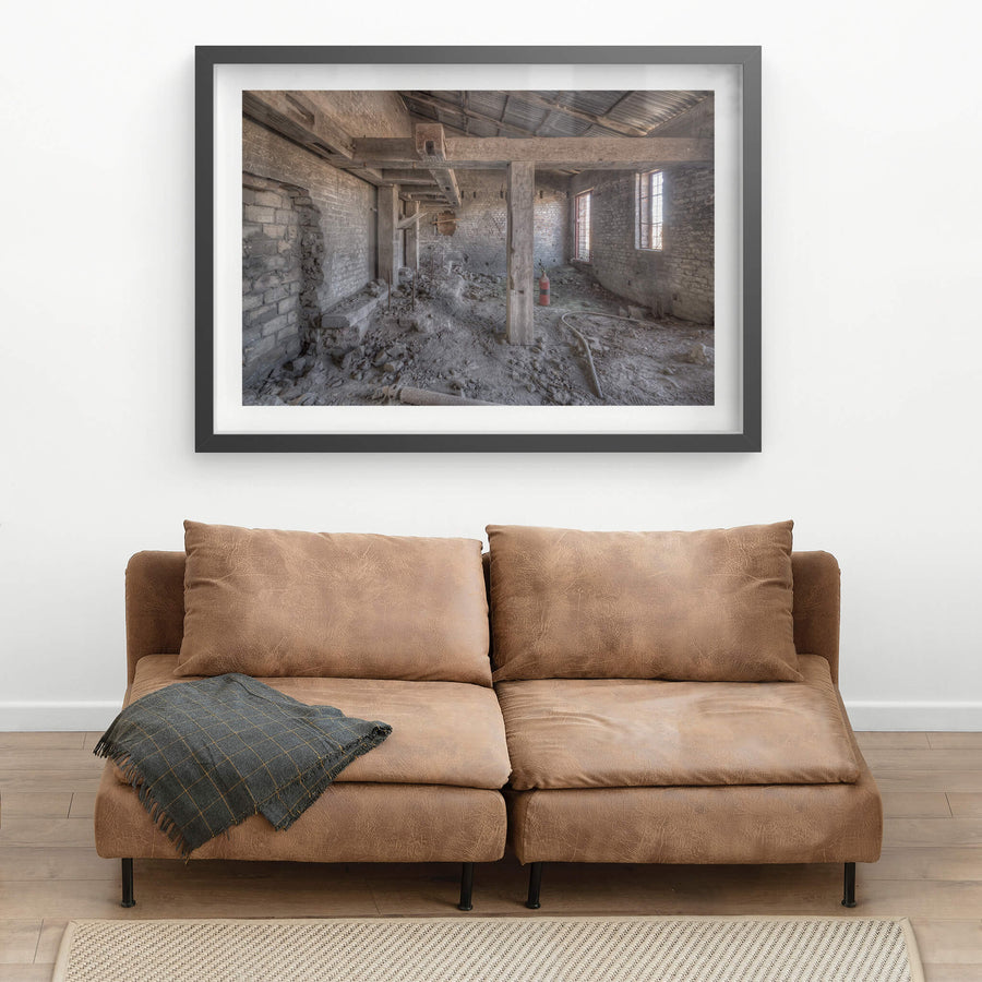 Raffan Mill Boiler House at Portland Cement Works, heavy timber posts rise from a floor buried in rubble and powdered morite.