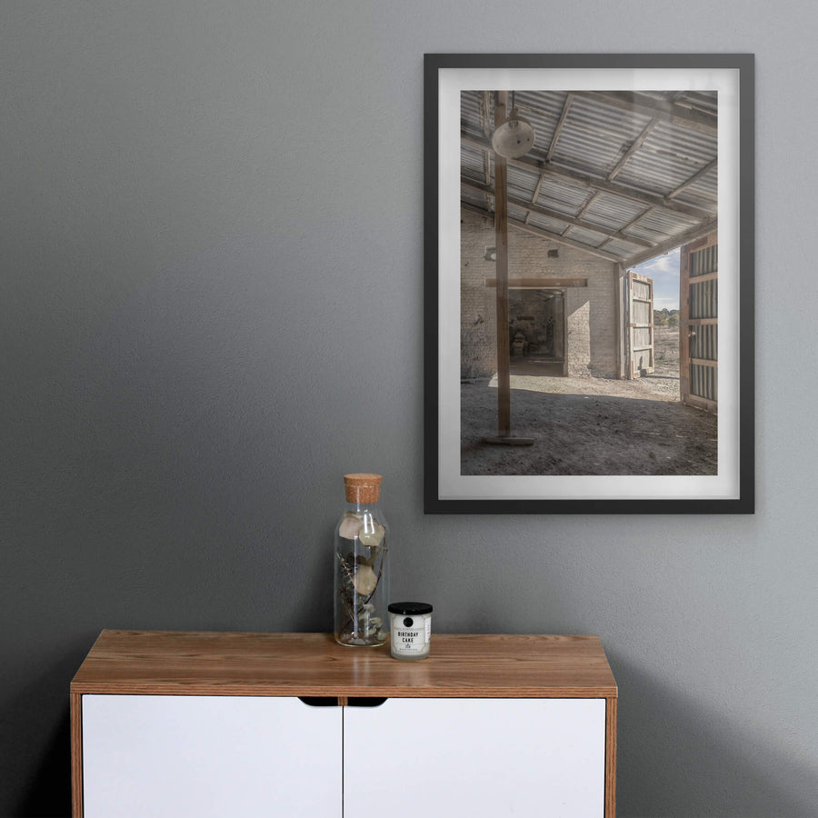 Raffan Mill Workshop at Portland Cement Works, a corrugated iron roof spans the workshop on rough-hewn timber beams.