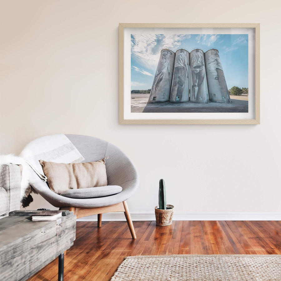 Silos at Portland Cement Works, four concrete silos stand in a row against open sky.