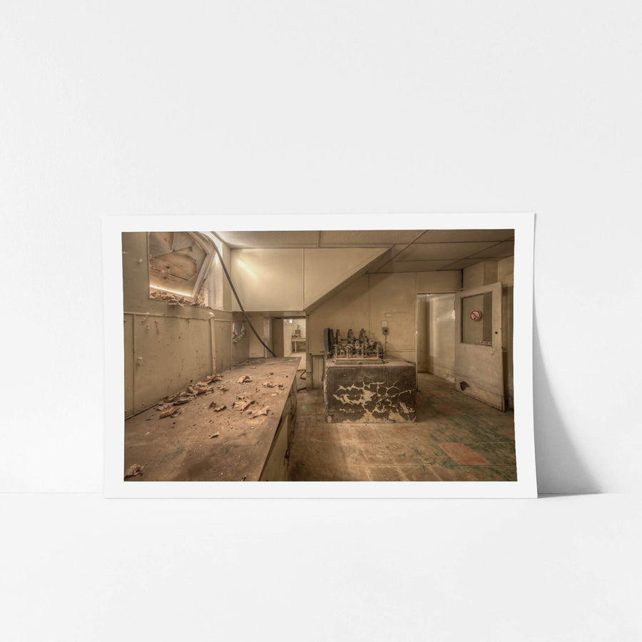 Testing Room at Portland Cement Works, a concrete bench runs the length of the room, covered in curled paint flakes.