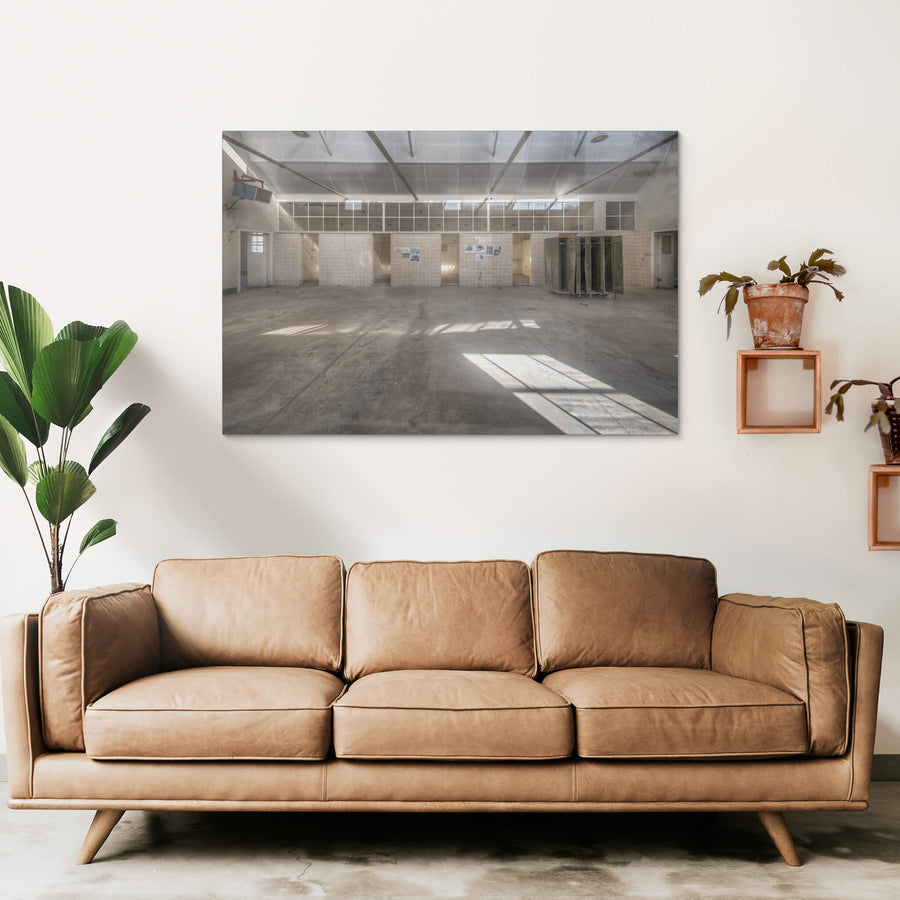 Wash House at Portland Cement Works, sunlight falls in clean geometric shapes across a concrete floor.