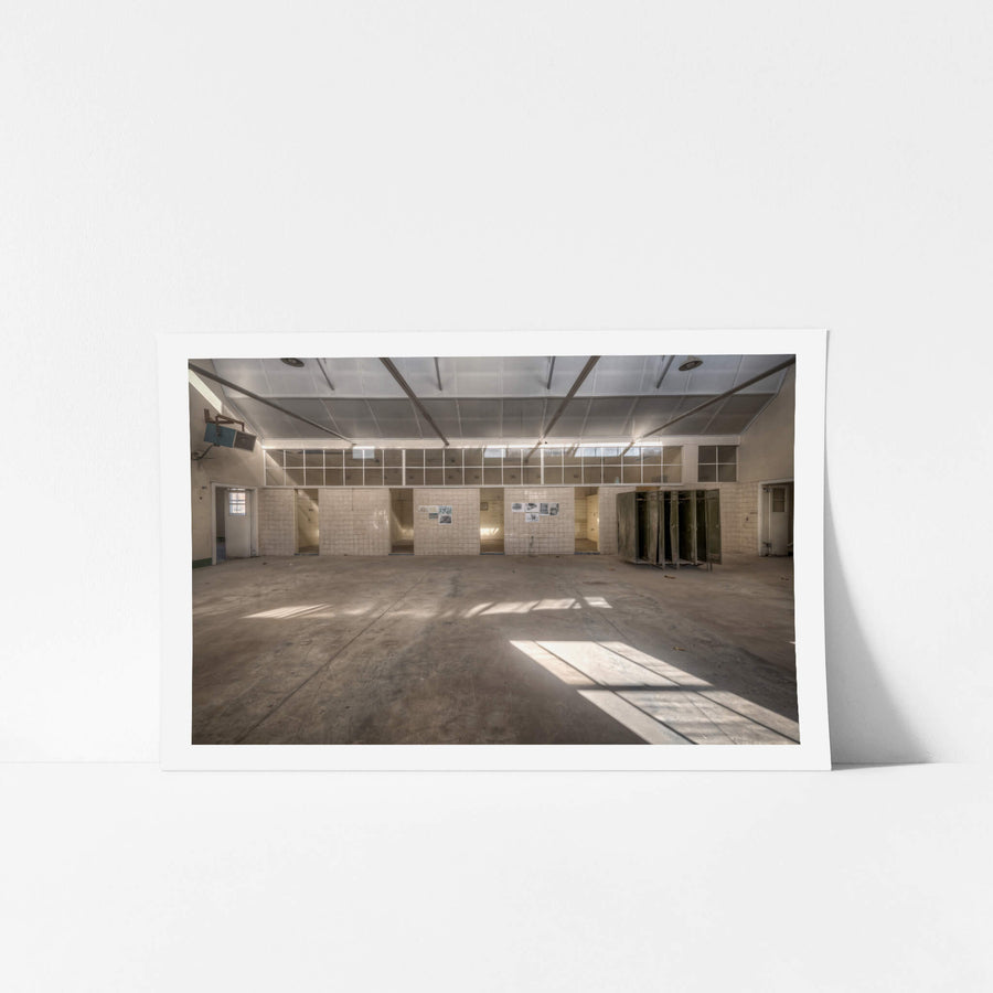 Wash House at Portland Cement Works, sunlight falls in clean geometric shapes across a concrete floor.