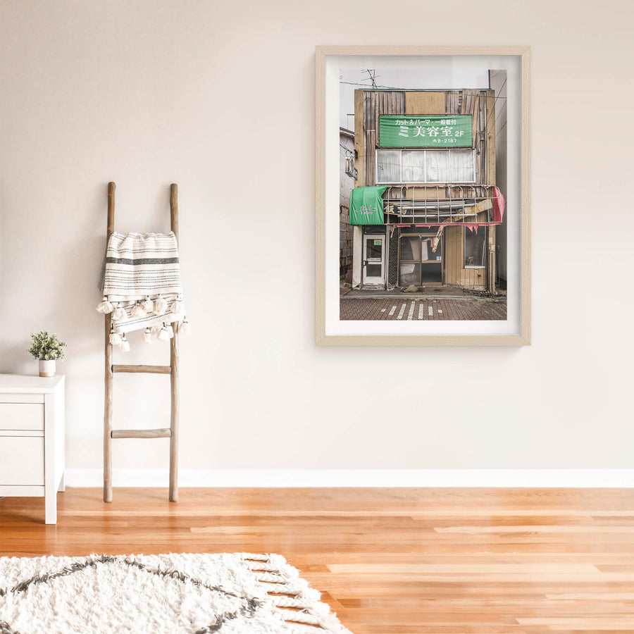 Shopfront at Streetscapes of Yubari, a two-storey shopfront on a quiet Yubari street.