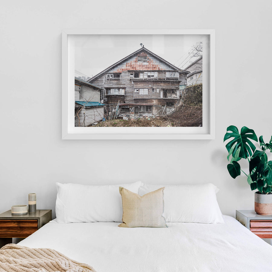 Side Facade at Streetscapes of Yubari, a shot from the side if an unstable building which would have once been a busy.