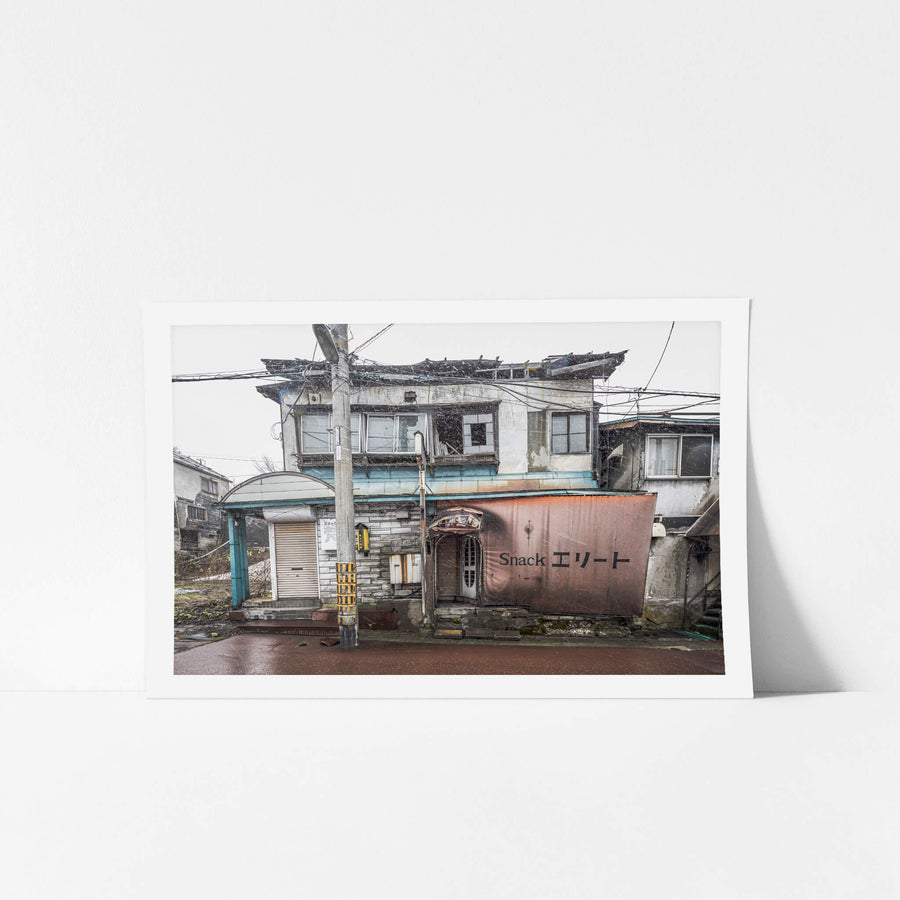 Snack Bar Elite at Streetscapes of Yubari, the roof of the building has collapsed under the weight of the snow build up.