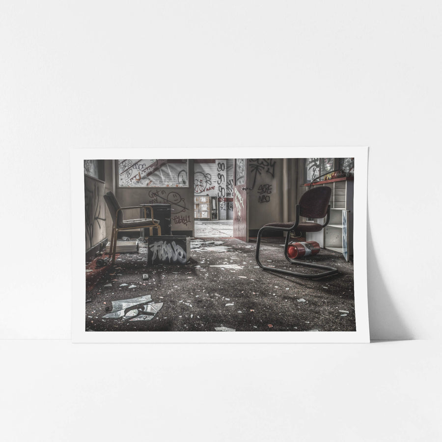 Consultation Room at Sundell Holden, two cantilever office chairs sit among broken glass and scattered debris.