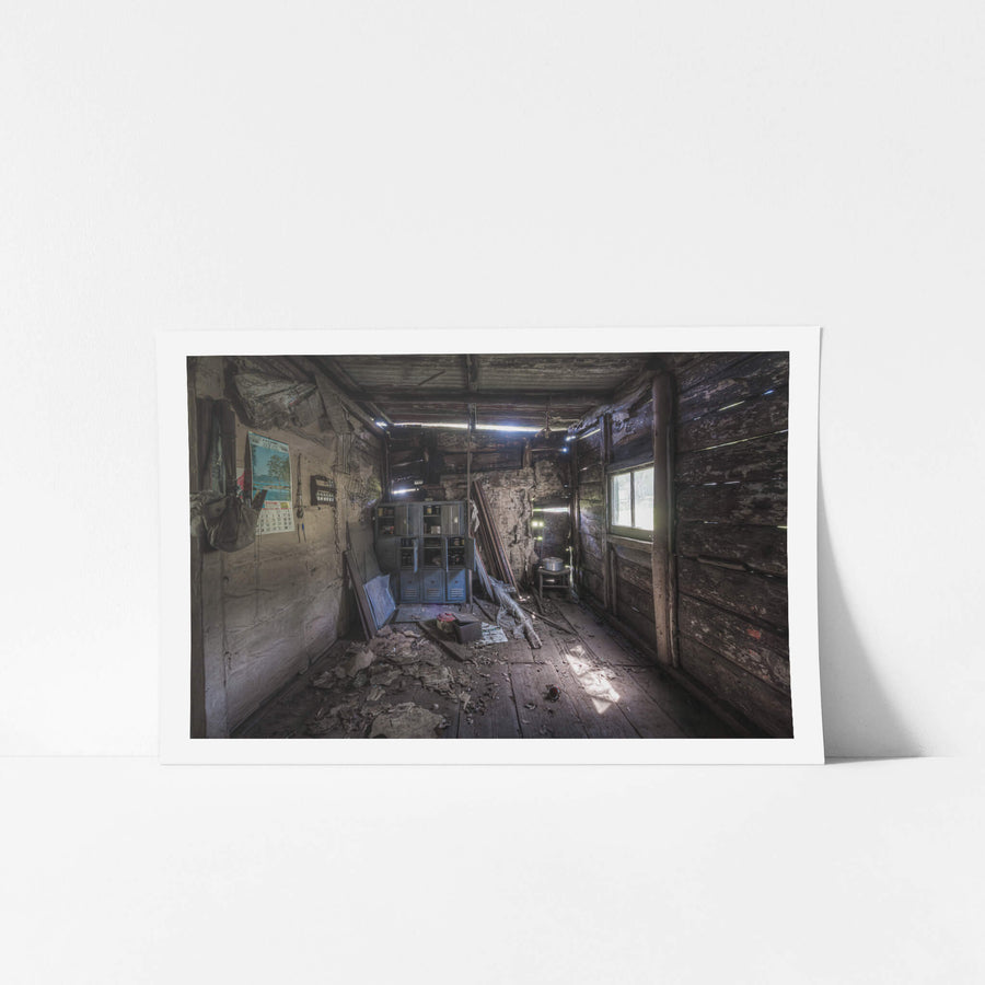 Rear Room at Woolla, a narrow room built from rough-sawn timber and lined with deteriorating plaster.