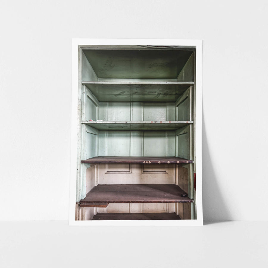 Bar Shelving at Terminus Hotel, a built-in timber cabinet sits behind the bar, its doors open.