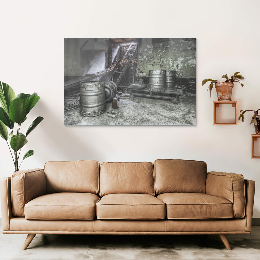Cellar at Terminus Hotel, three stainless steel beer kegs sit on a concrete floor.