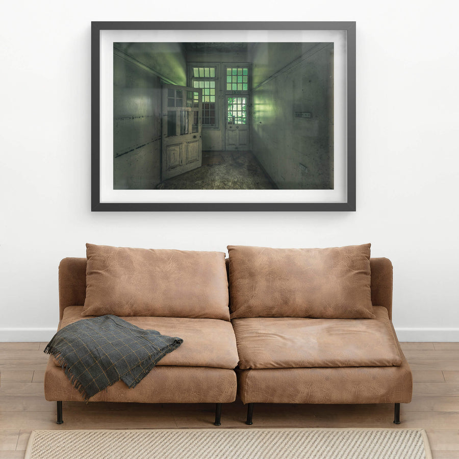 Exit at The Asylum, a narrow corridor ends at two panelled timber doors.