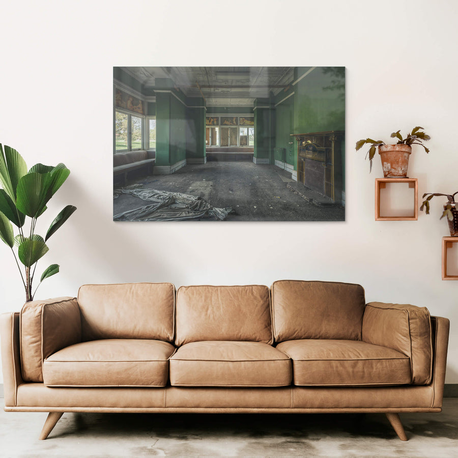 The Green Room at The Asylum, a deserted room with raunchy hand-painted works above the windows.