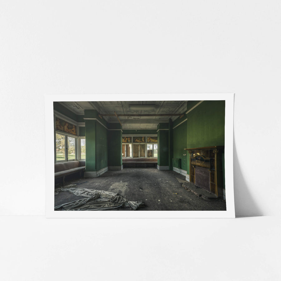 The Green Room at The Asylum, a deserted room with raunchy hand-painted works above the windows.