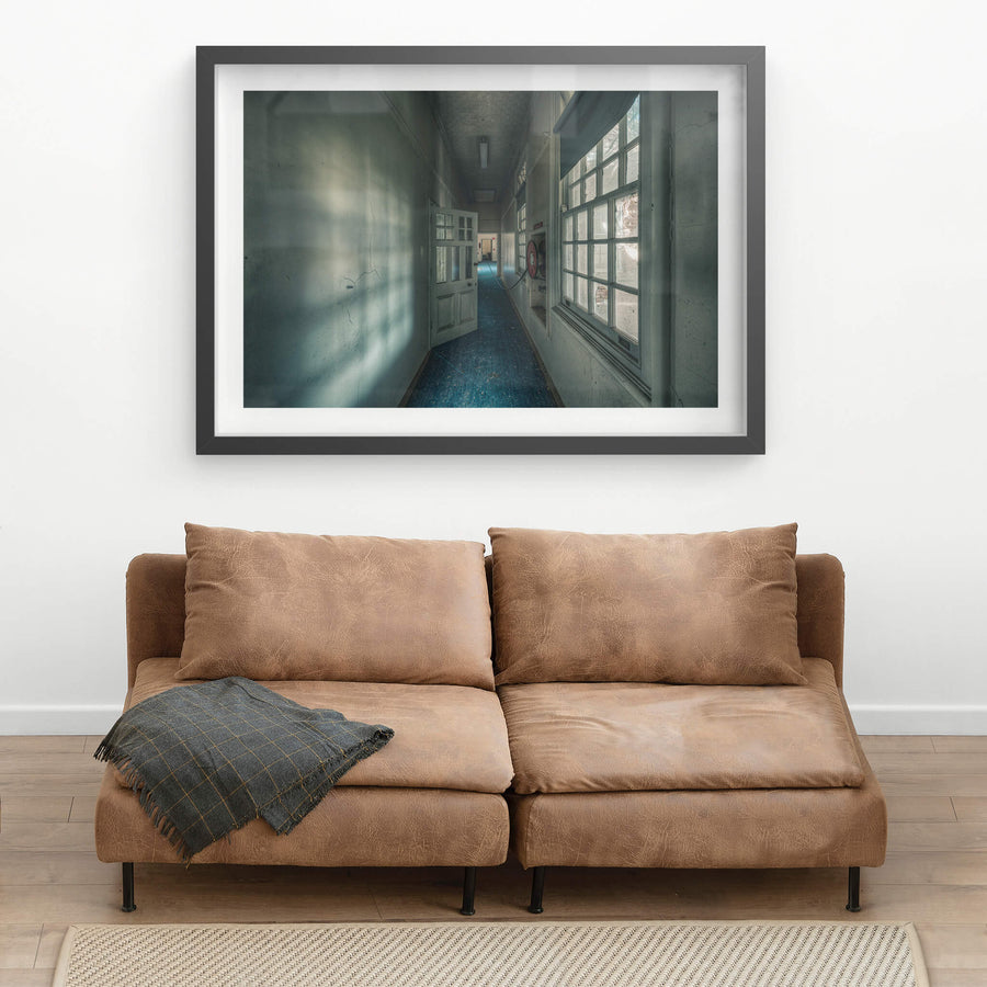 Long Blue Walk at The Asylum, a narrow corridor stretches deep into the building.