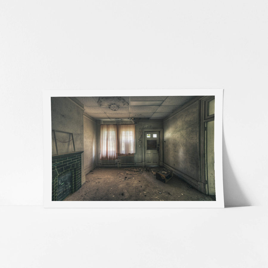 Recreation Room at The Asylum, faded pink curtains filter grey light through a pair of windows.