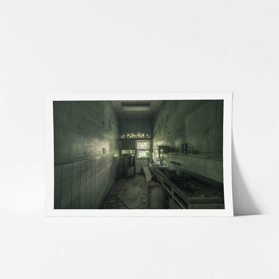 Sluice Room at The Asylum, a narrow sluice room lined with white ceramic tiles to waist height.