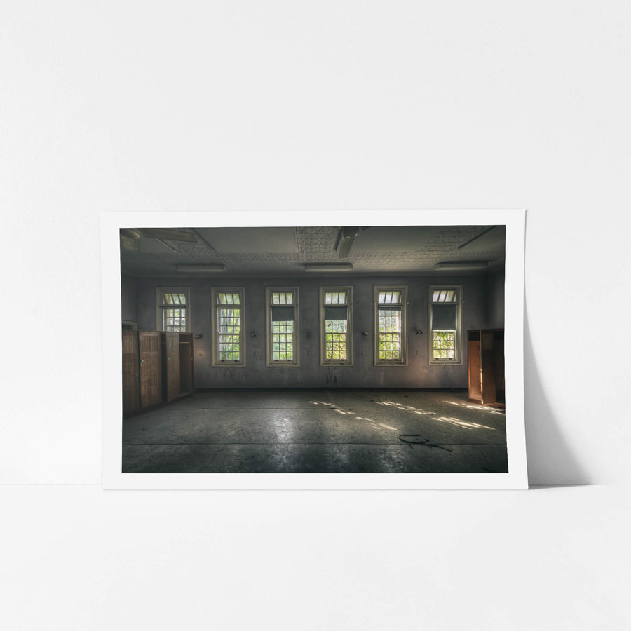 Ward Windows at The Asylum, five tall windows line the ward wall, each divided into small panes with transom lights above.