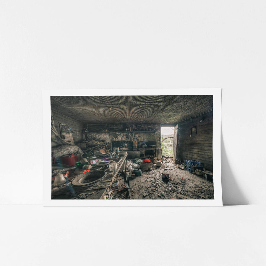 Kitchen at The Post Office, a low corrugated iron ceiling presses down over a single room.