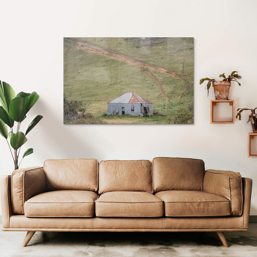 Bottom Of The Hill at The Woolshed, a fibro and corrugated iron shed sits low in a shallow gully, dwarfed by the green.