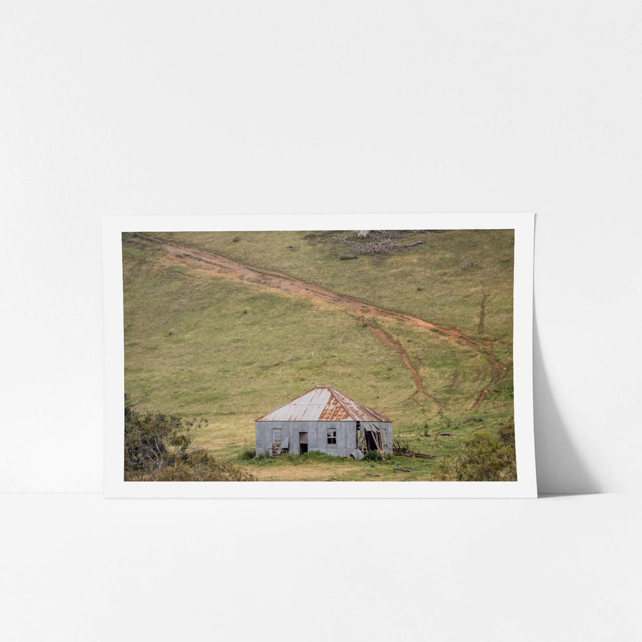 Bottom Of The Hill at The Woolshed, a fibro and corrugated iron shed sits low in a shallow gully, dwarfed by the green.