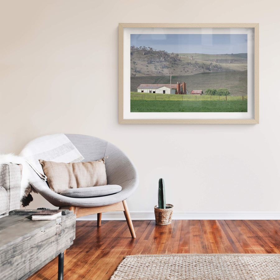 Maffra Shearers Quarters at The Woolshed, a weatherboard shearing quarters sits low in green pasture, its corrugated iron.