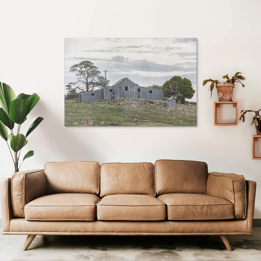 Numbla Vale Woolshed at The Woolshed, a corrugated iron woolshed perched atop a rocky crest.