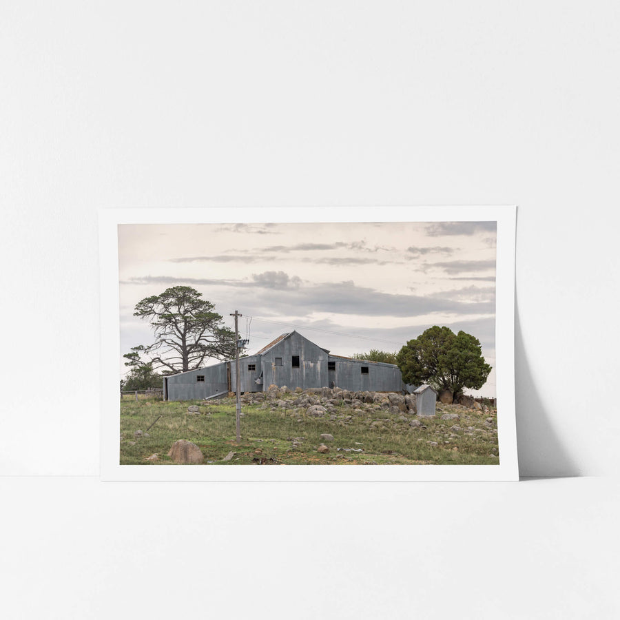 Numbla Vale Woolshed at The Woolshed, a corrugated iron woolshed perched atop a rocky crest.