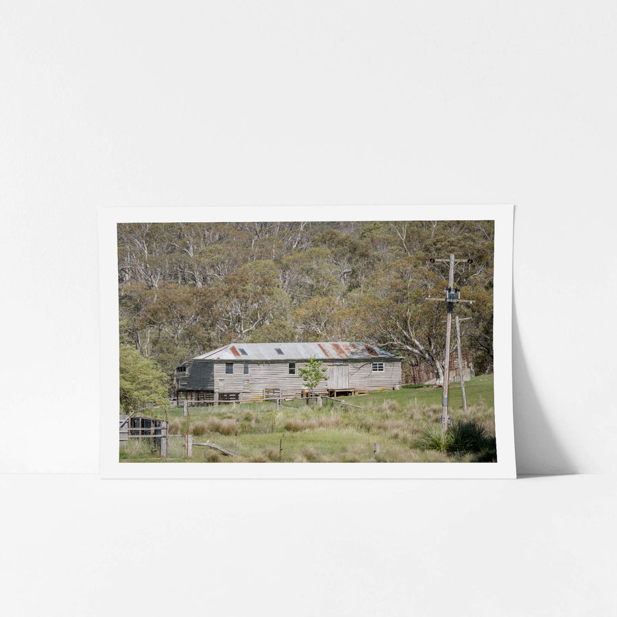 Telegraph And Telephone Office at The Woolshed, a weatherboard building sits low in a clearing, its corrugated iron roof.