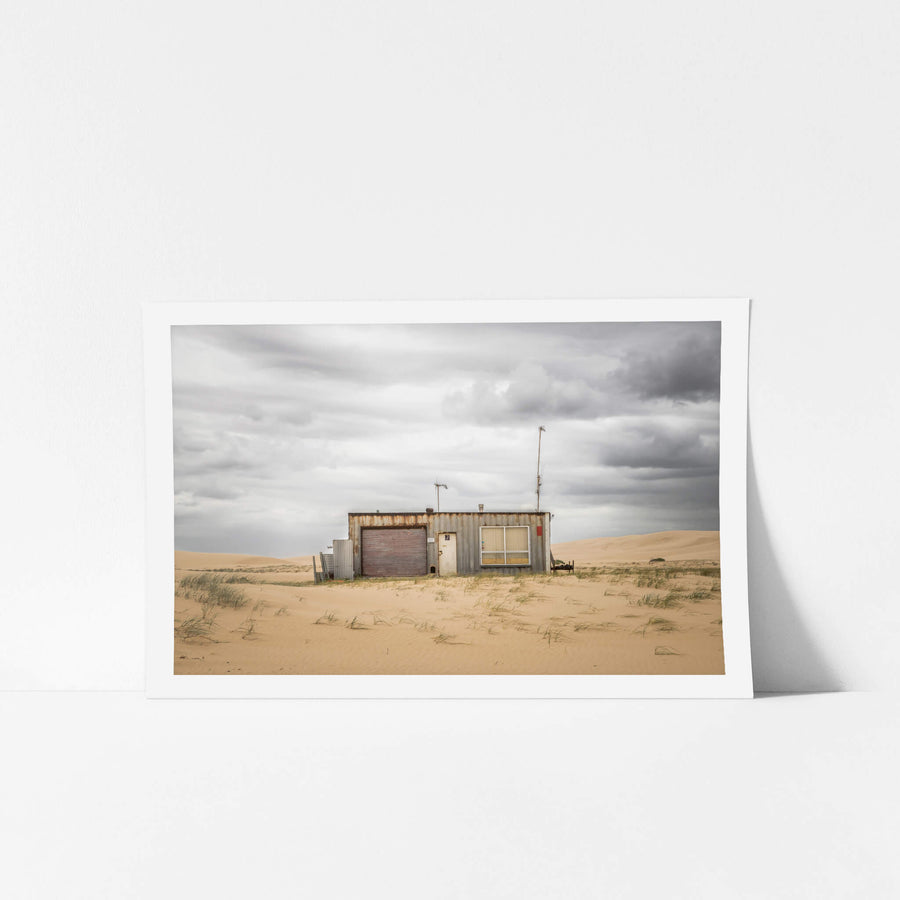 Seven at Tin City, shack number seven sits low against the dunes at Tin City, Stockton Beach.