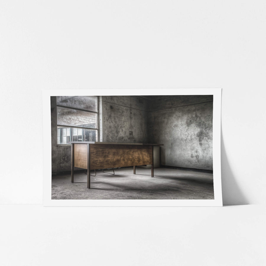 Office Desk at Wangi Power Station, a timber veneer desk sits alone in a concrete room.