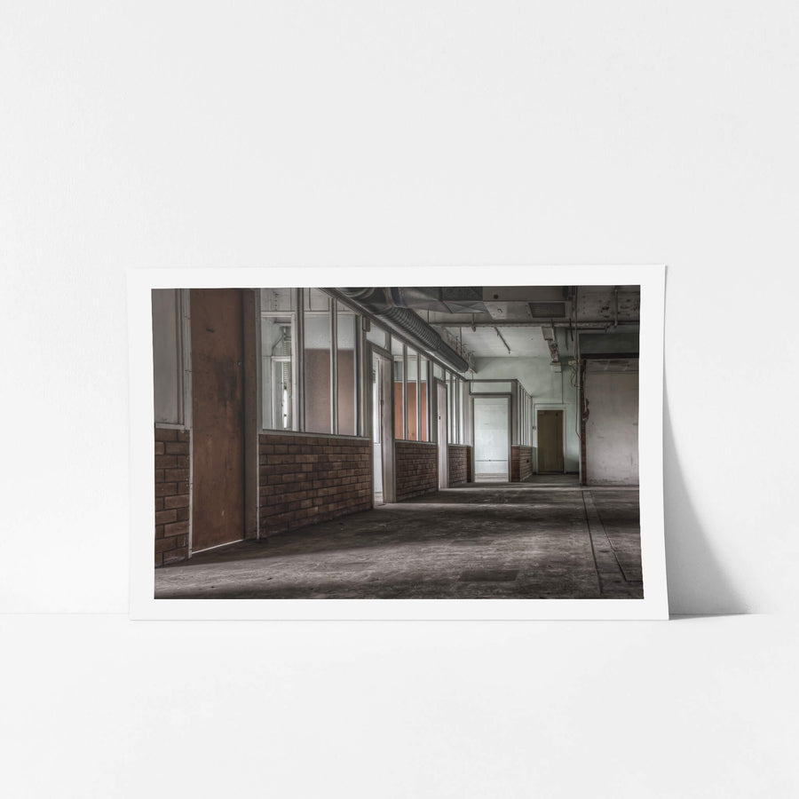 Training Section Offices at Wangi Power Station, a row of partitioned offices lines the corridor, brick half-walls topped.