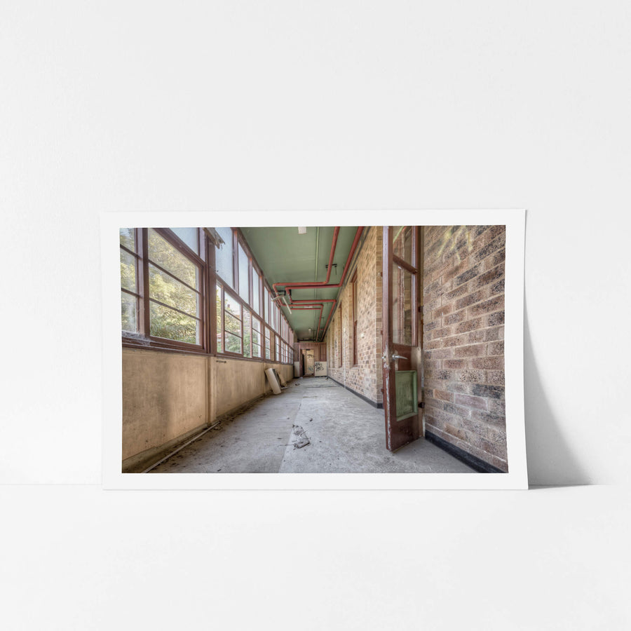 Annex at Waterfall Sanatorium, a long enclosed corridor runs between a brick ward building and a wall of timber-framed.