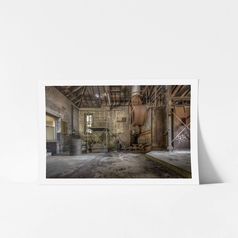 Boiler House at Waterfall Sanatorium, a heavy industrial boiler sits against the far wall, its casing oxidised to a deep.