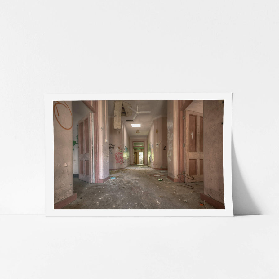 Every Which Way at Waterfall Sanatorium, a corridor runs deep into the building, its pink-painted walls faded to a chalky.