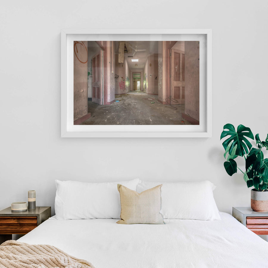 Every Which Way at Waterfall Sanatorium, a corridor runs deep into the building, its pink-painted walls faded to a chalky.