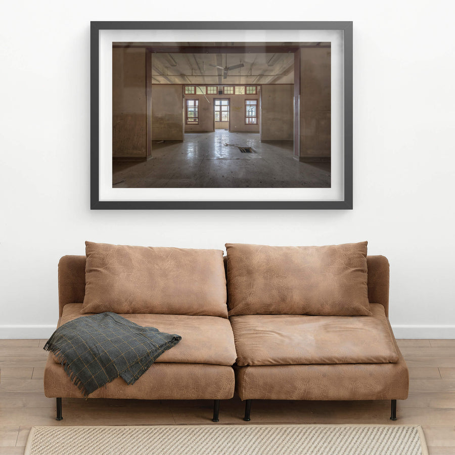 Squares In Squares at Waterfall Sanatorium, timber posts frame a sequence of open rooms, each threshold leading deeper.