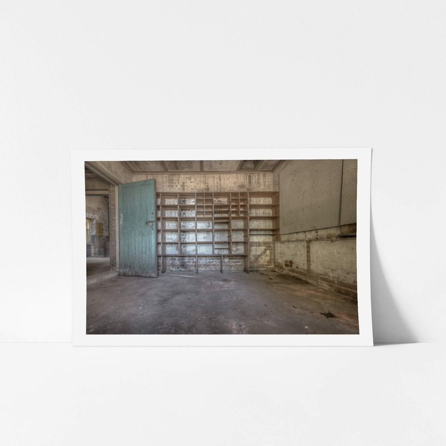 Storage Shelves at Waterfall Sanatorium, a timber shelving unit covers the back wall, its grid of open compartments.
