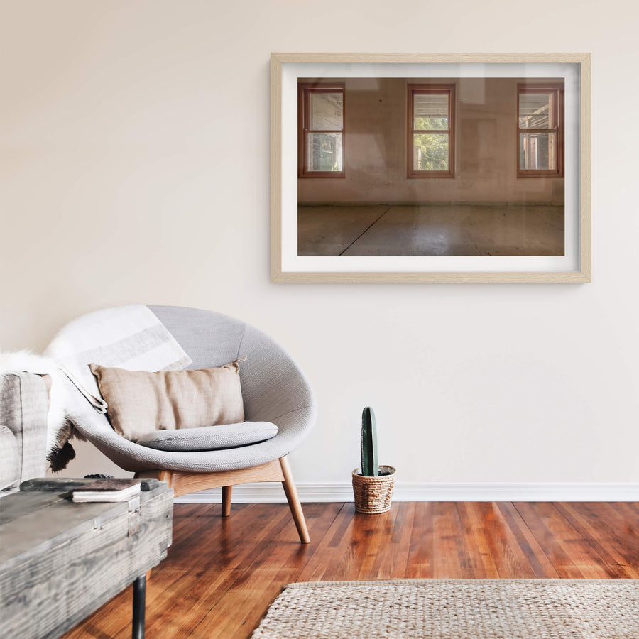 Three Windows at Waterfall Sanatorium, three timber-framed windows sit evenly spaced across a rendered wall.