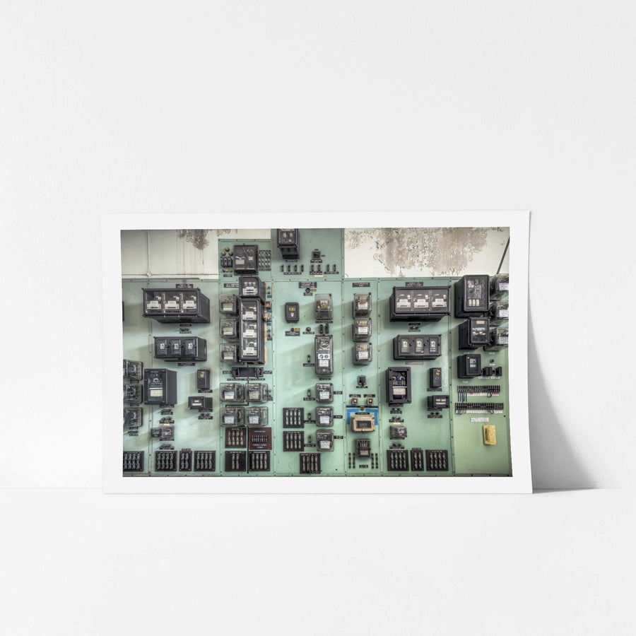 Ammeters at White Bay Power Station, protection relay panels line the wall in pale green steel, mounted floor to ceiling.