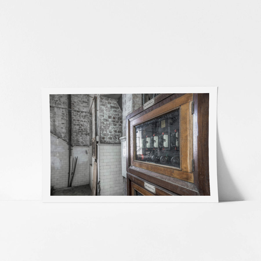 Breaker Box at White Bay Power Station, a timber-framed switchboard cabinet sits against bare brick.