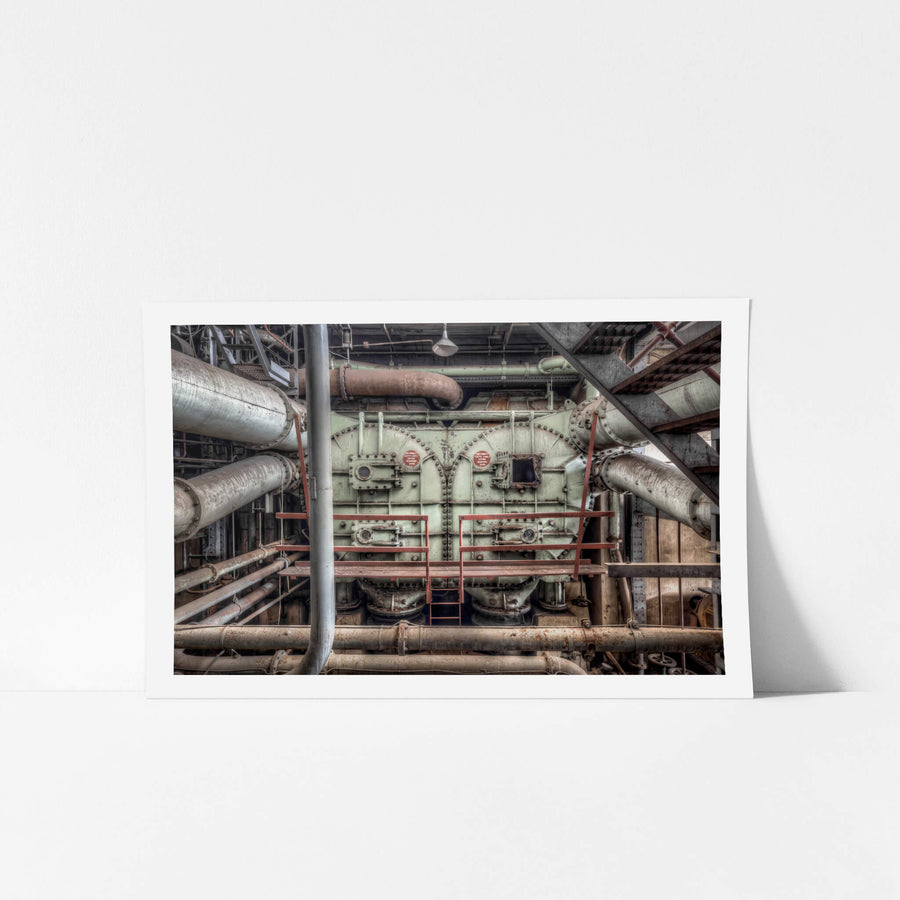 Condenser at White Bay Power Station, a pale green steel casing fills the frame, bolted together with rows of heavy rivets.