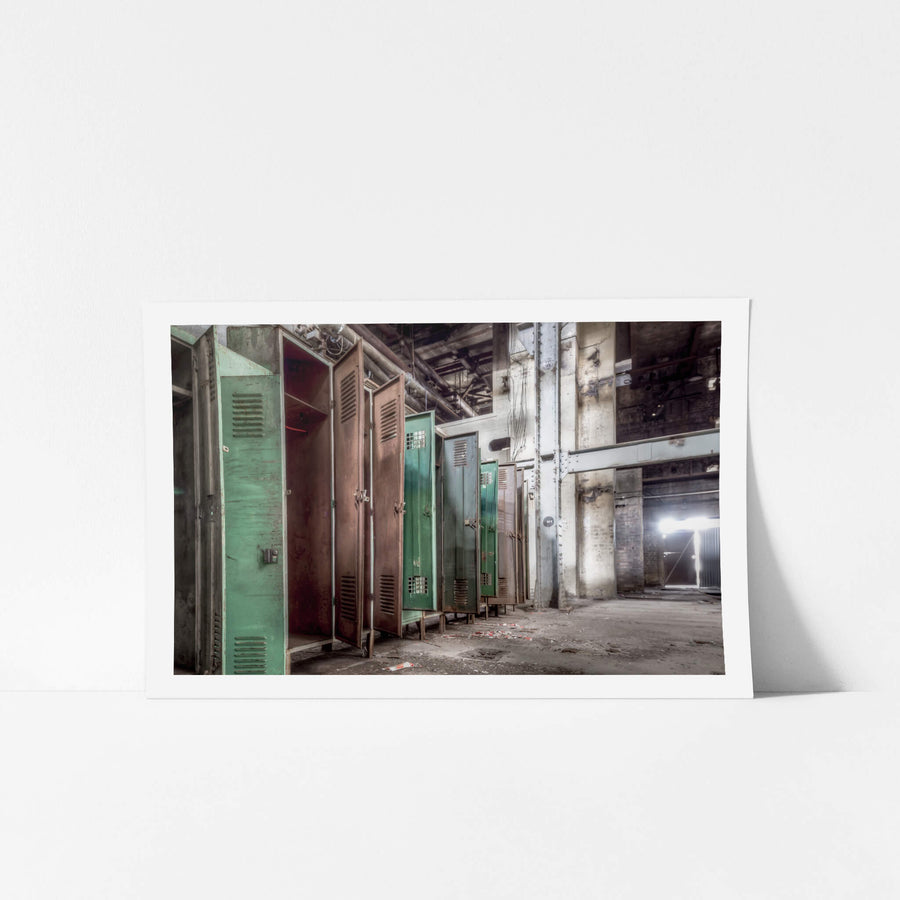 Lockers at White Bay Power Station, steel lockers line a concrete wall, doors hanging open.