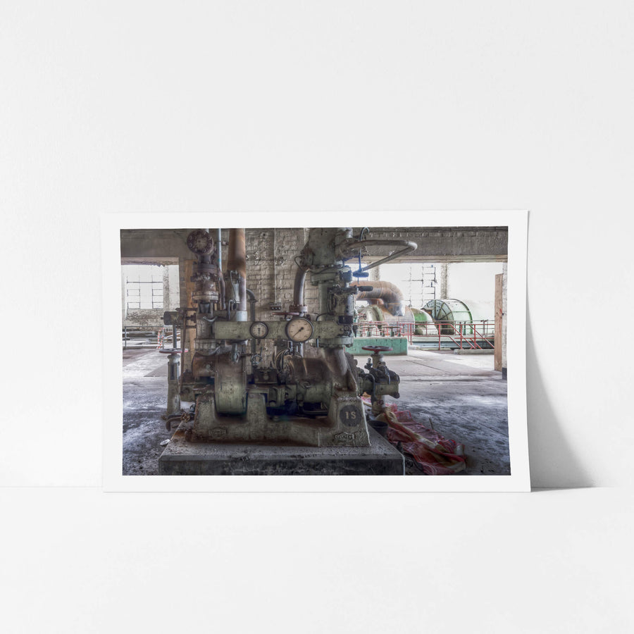 Steam Compressor at White Bay Power Station, a cast-iron steam pump sits bolted to its concrete plinth on the turbine hall.