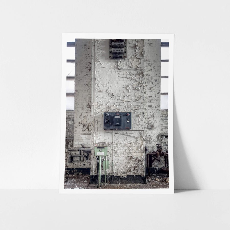 Turbine Hall Alarms at White Bay Power Station, a white-painted brick column rises between tall industrial windows.