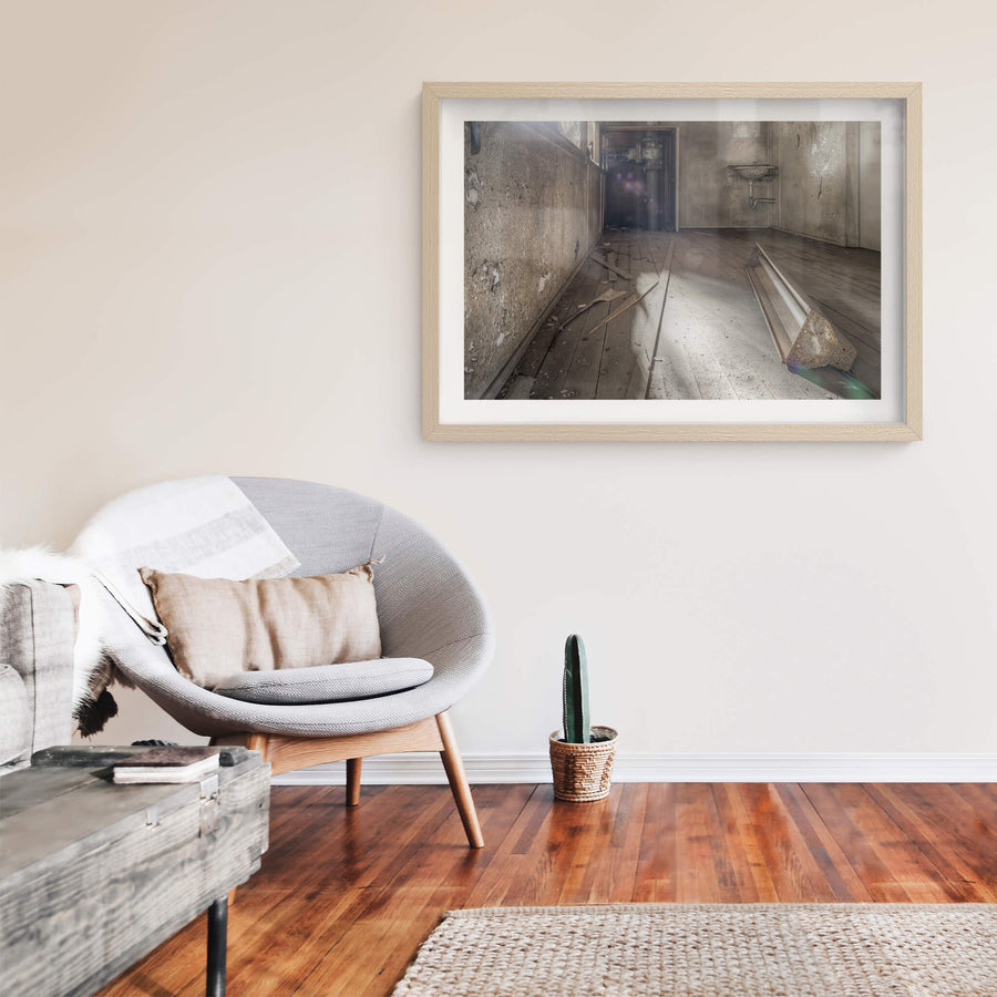 Turbine Hall Crib Room at White Bay Power Station, a fluorescent light fixture lies face-down on bare timber floorboards.