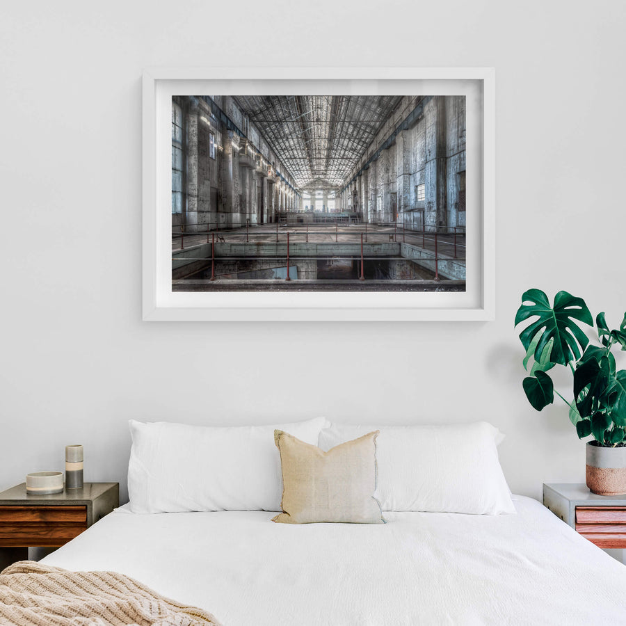 Turbine Hall at White Bay Power Station, reinforced concrete walls rise three storeys on each side, their surfaces stained.