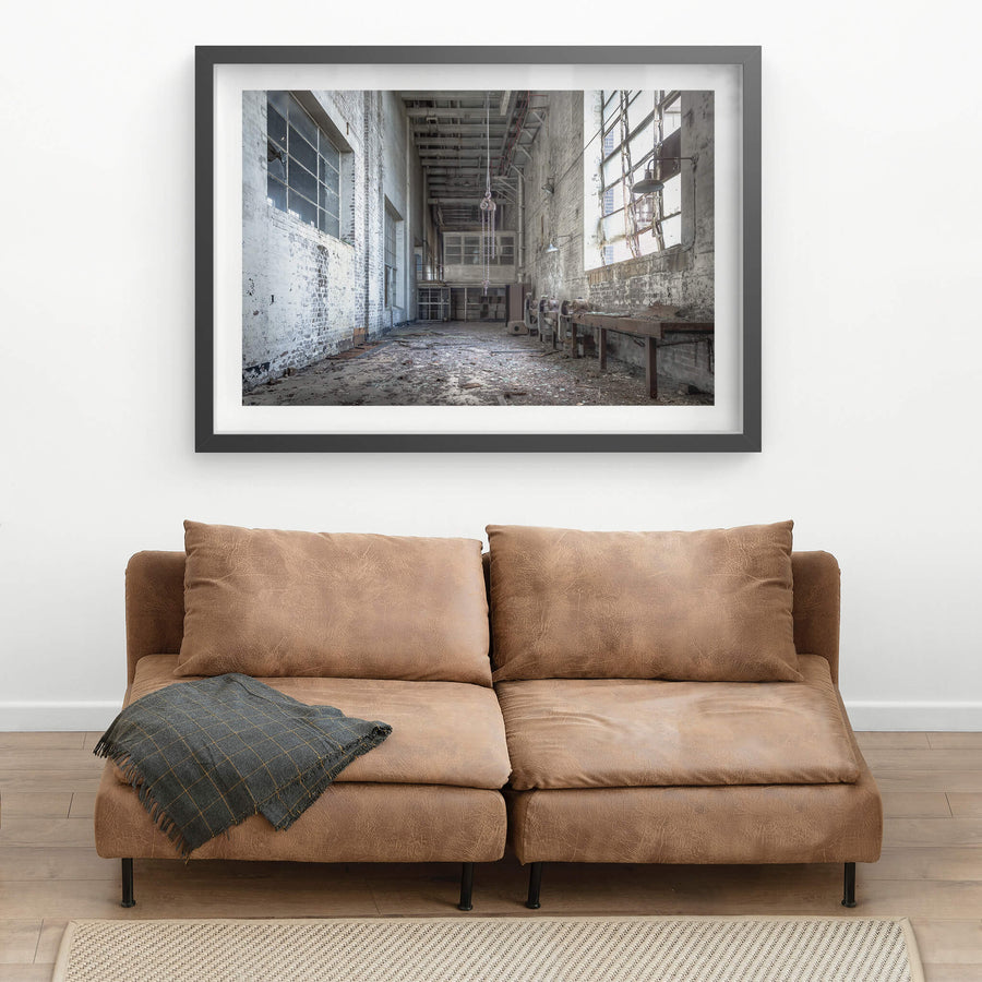Workshop at White Bay Power Station, a chain block hangs from the ceiling on heavy links, motionless above a floor thick.