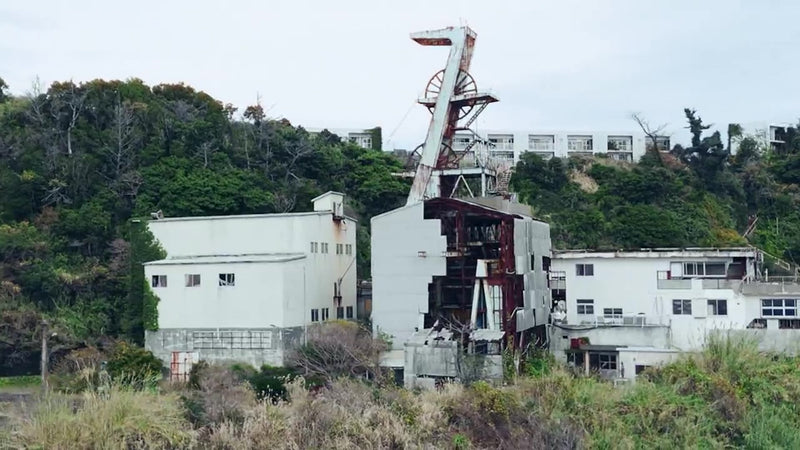 Ikeshima from the air, the mine buildings and the settlement on the rock with the sea beyond